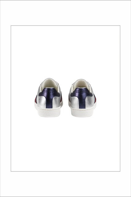 Silver sneaker with red and blue band