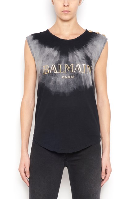 t-shirt with gold buttons and gold logo